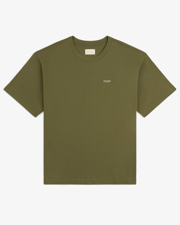 Safari Tee in olive green with short sleeves and a small white logo on the left chest, shown on a white background.