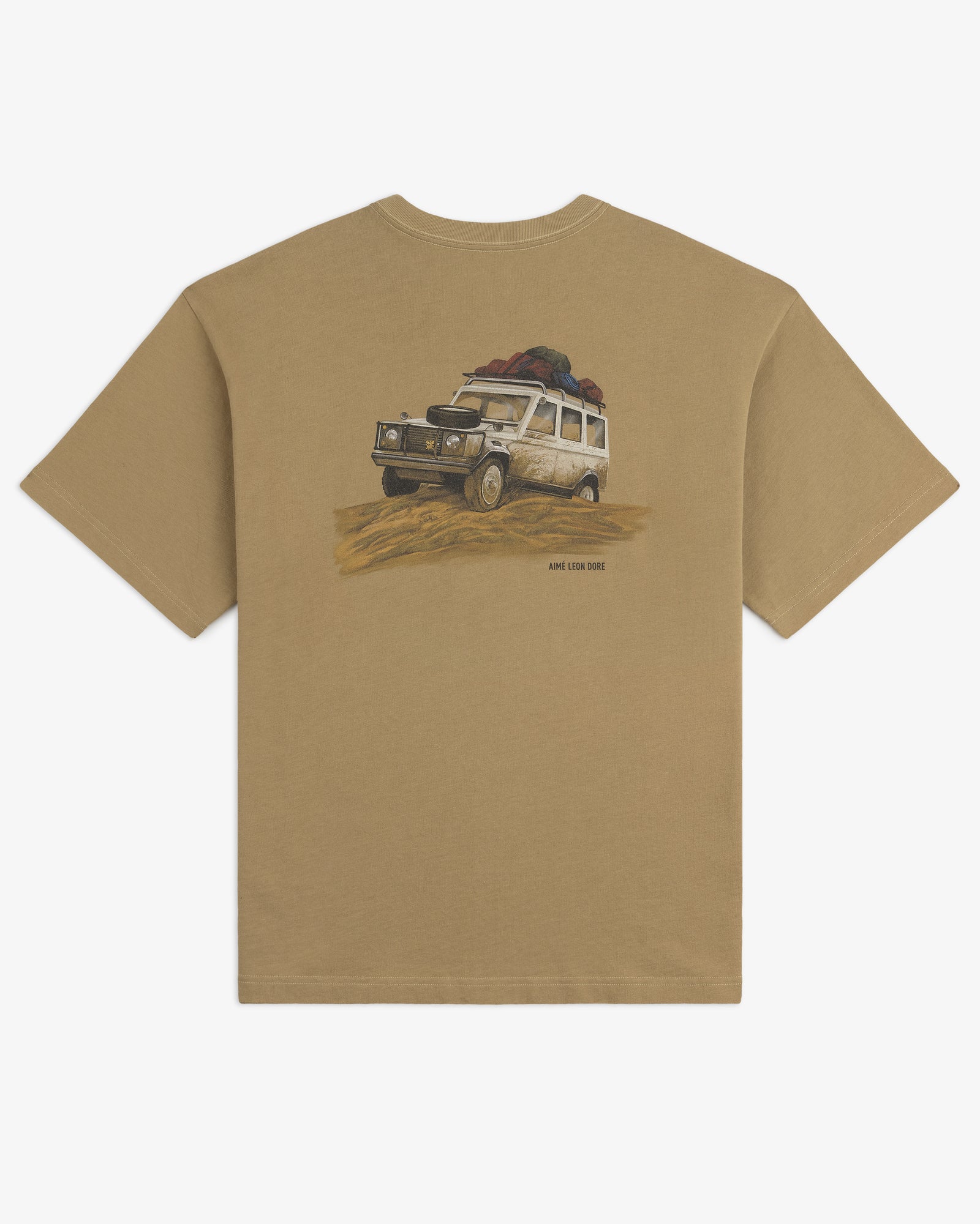 Safari Tee: Tan t-shirt featuring a white off-road vehicle loaded with gear driving on sand.