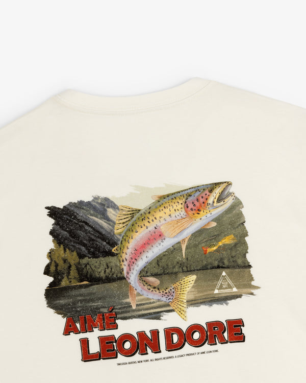Back of the Catch & Release Tee features a jumping trout, mountain scene, and "AIMÉ LEON DORE" in bold red letters.