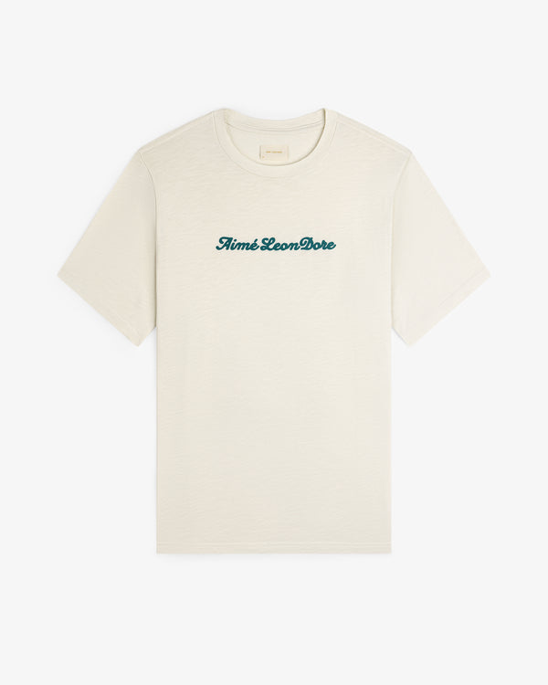 Off-white Puff Print Slub Logo Tee with Aimé Leon Dore in green script across the chest.