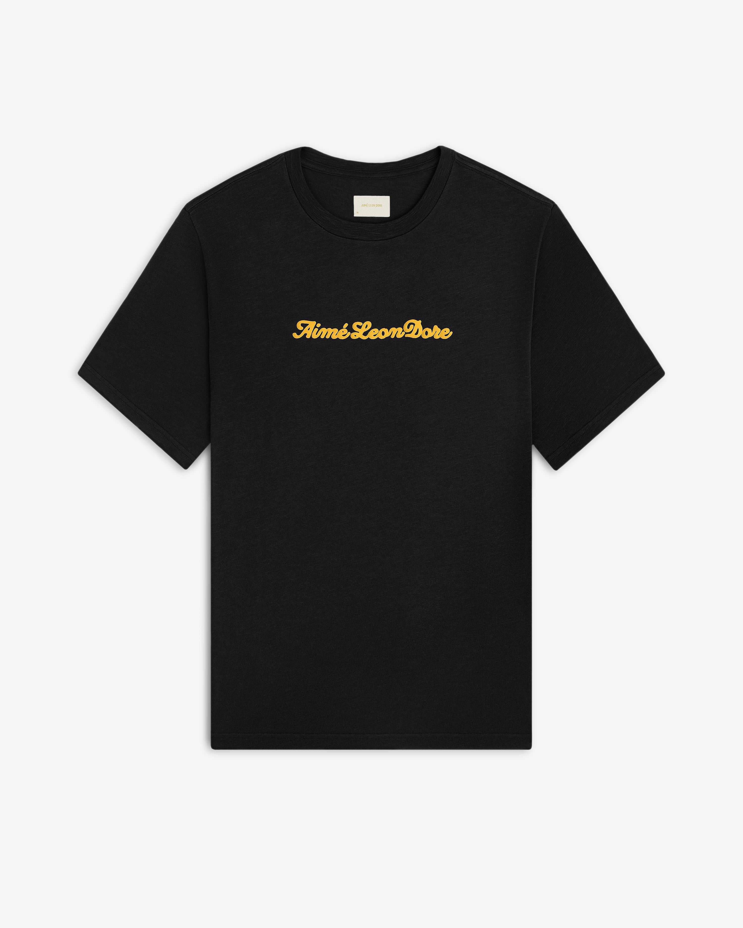 Black Puff Print Slub Logo Tee with Aimé Leon Dore in yellow cursive text across the chest.
