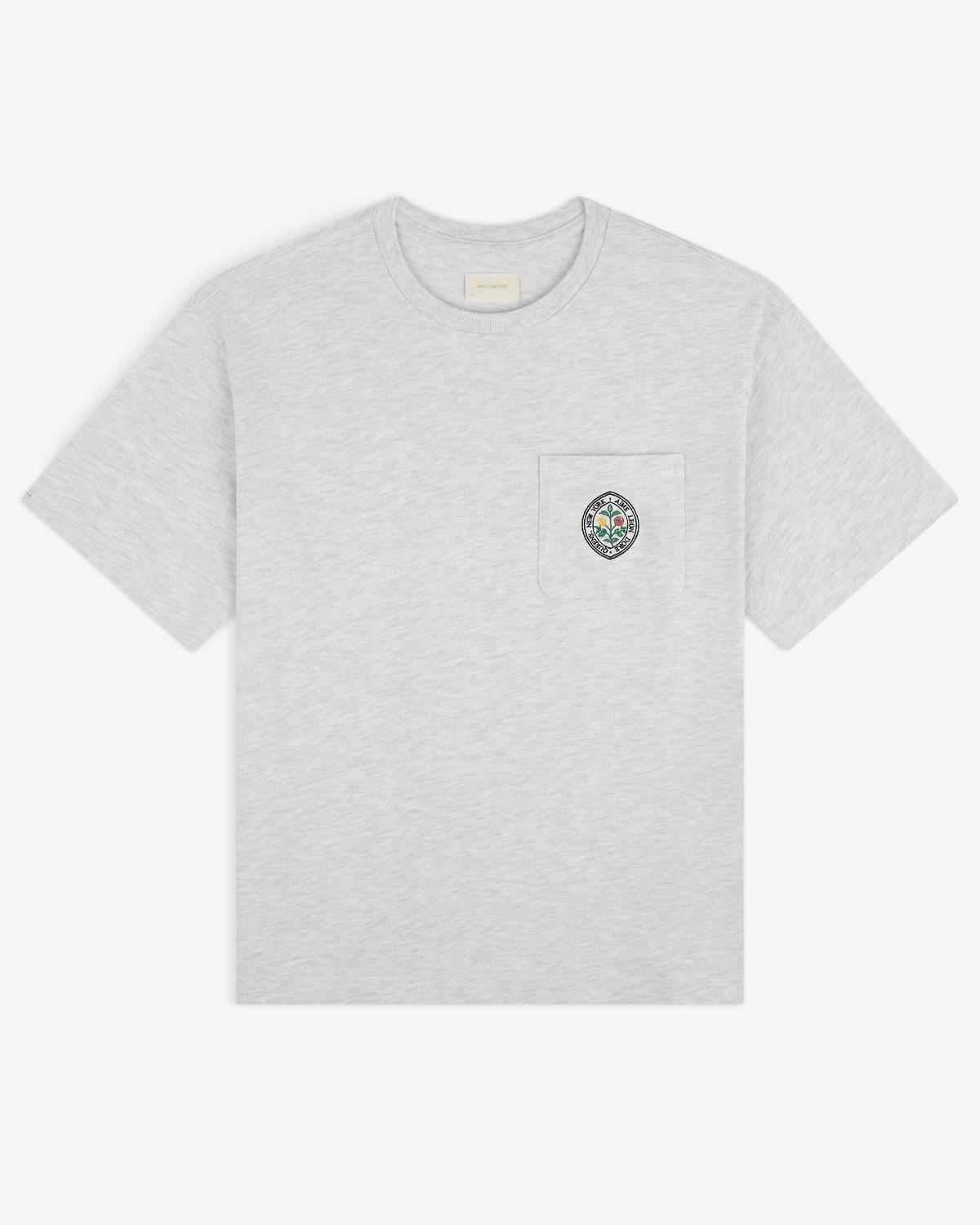 Light grey Botanical Crest Pocket Tee with short sleeves and a chest pocket featuring colorful circular embroidery.