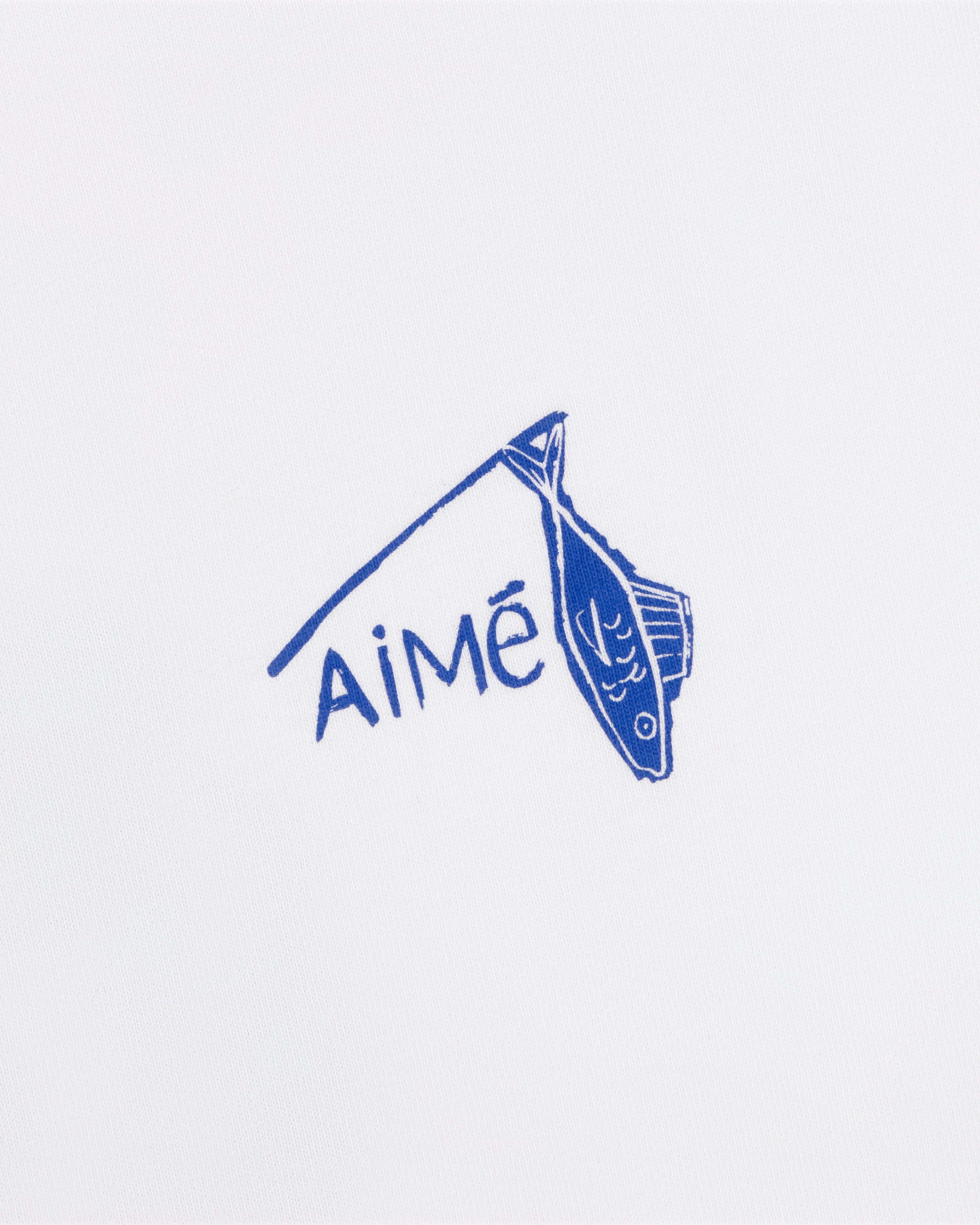 Blue fish illustration and "Aimé" on white background, featured on the Fisherman Tee.