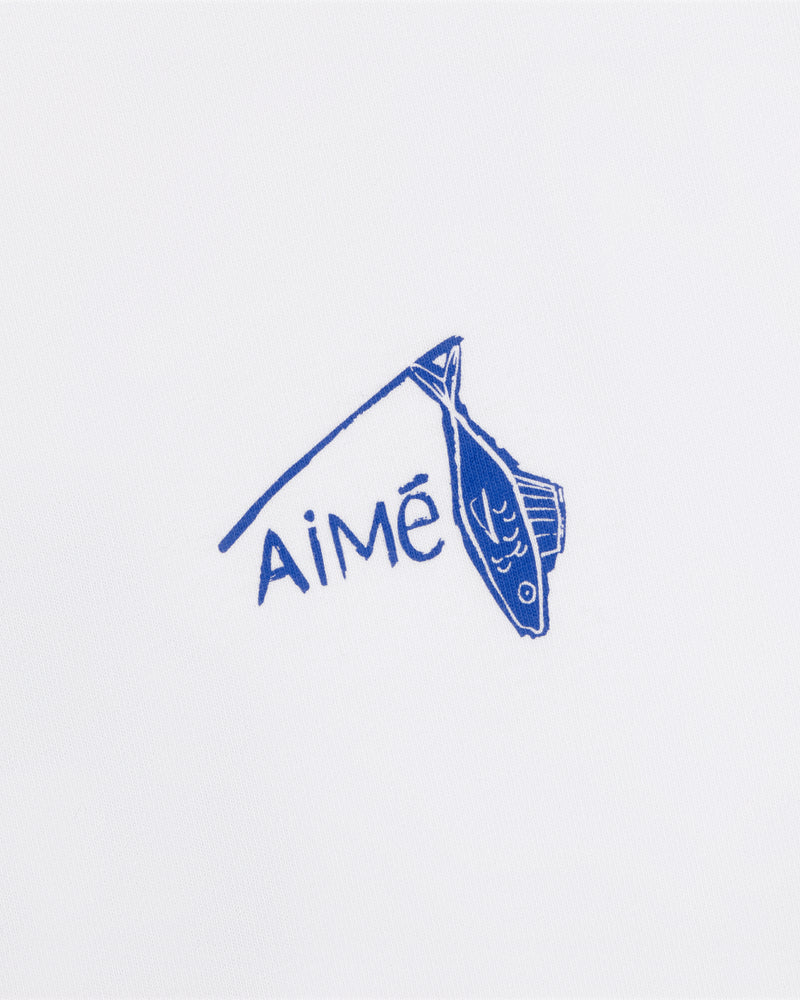 Blue fish illustration and "Aimé" on white background, featured on the Fisherman Tee.