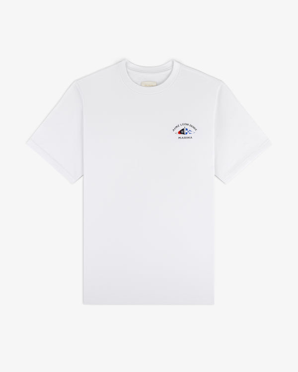 Marina Tee: white short-sleeve with small blue and red graphic and text on upper left chest.