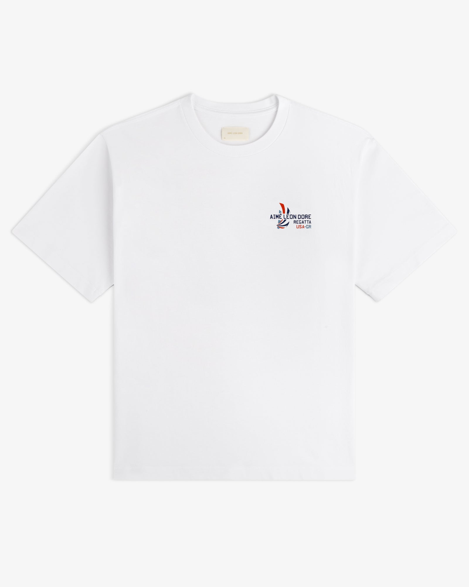 Regatta Tee: white short-sleeve t-shirt with small multicolor graphic and text on left chest.