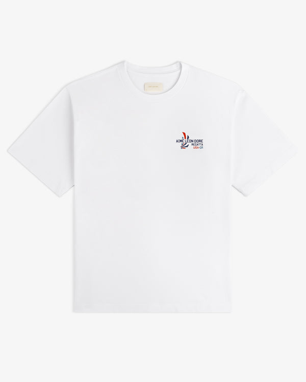 Regatta Tee: white short-sleeve t-shirt with small multicolor graphic and text on left chest.