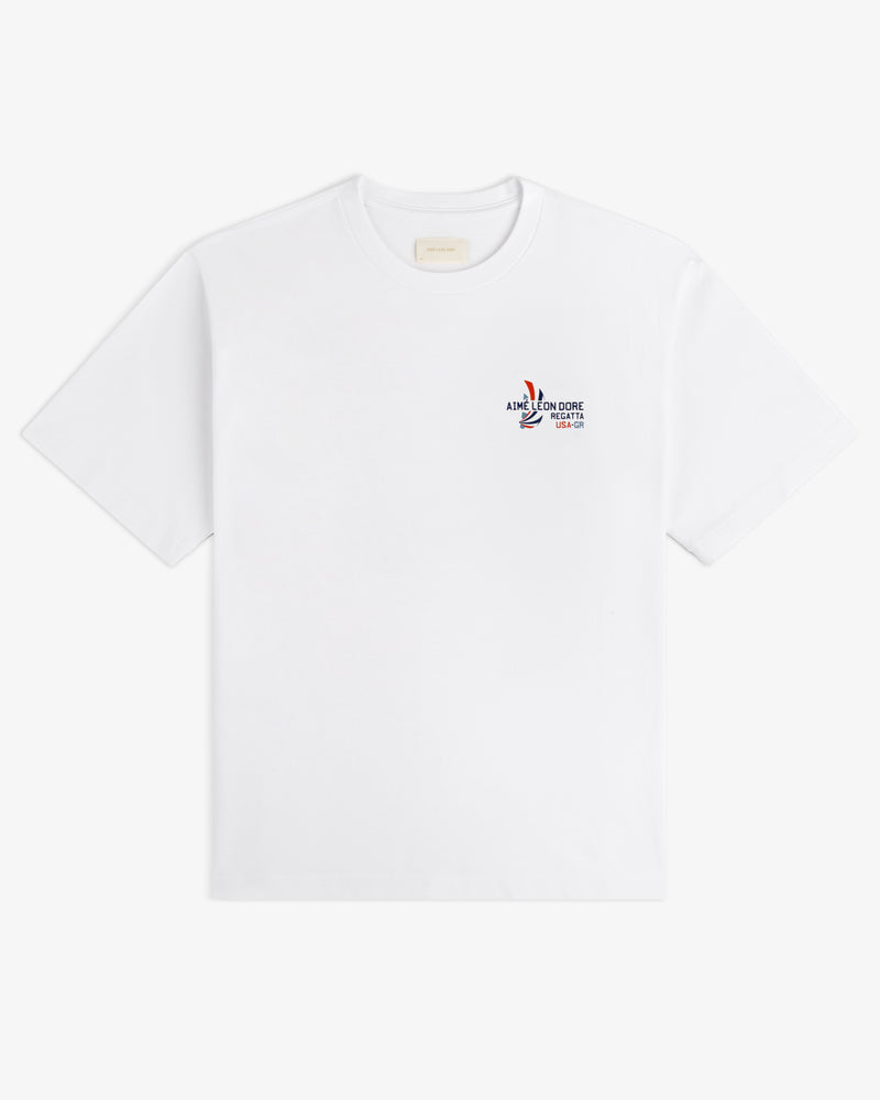 Regatta Tee: white short-sleeve t-shirt with small multicolor graphic and text on left chest.