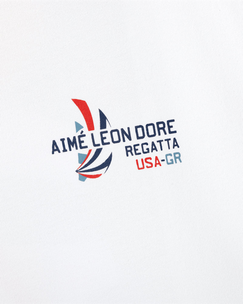 The Regatta Tee features "AIMÉ LEON DORE REGATTA USA-GR" and a red, blue, gray sailboat on white fabric.