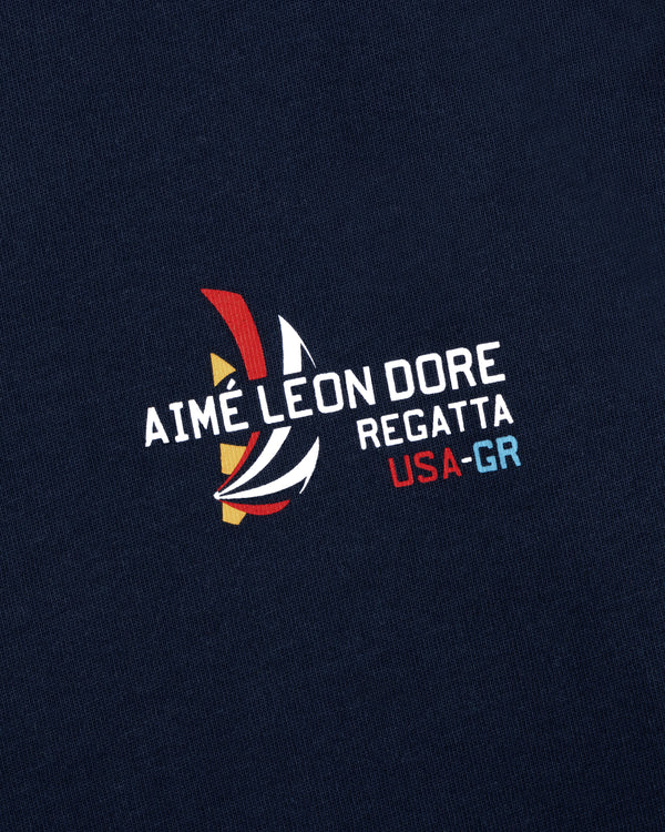Regatta Tee in navy with AIMÉ LEON DORE REGATTA USA-GR and colorful abstract sailboat graphic print.