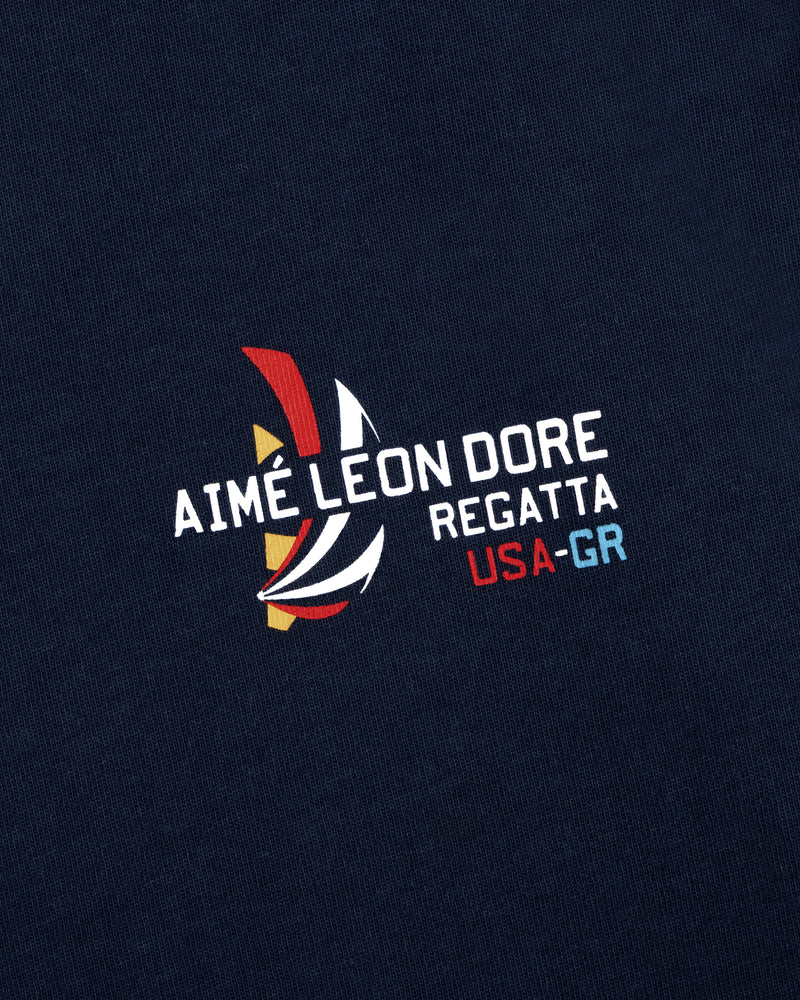 Regatta Tee in navy with AIMÉ LEON DORE REGATTA USA-GR and colorful abstract sailboat graphic print.