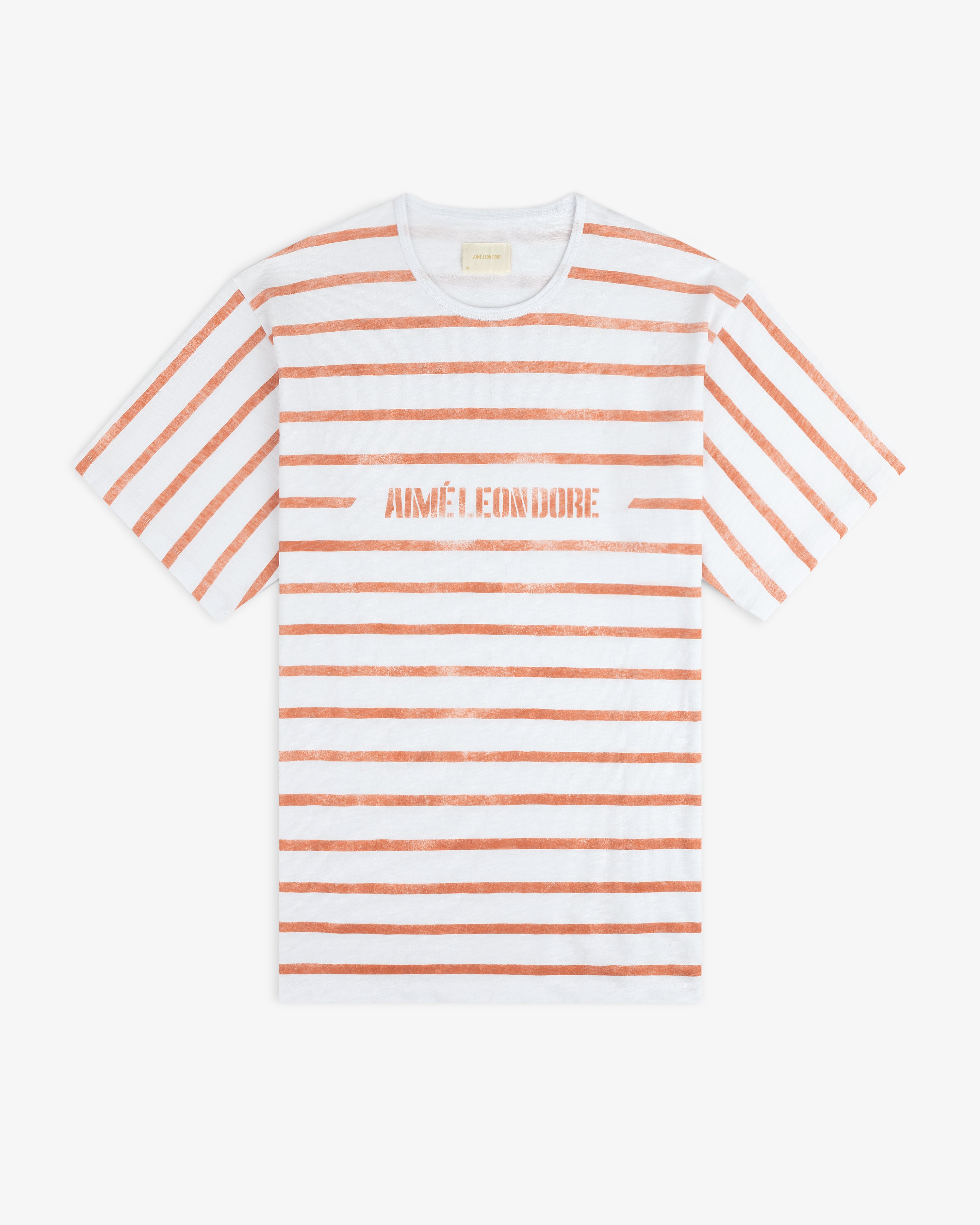 Slub Beach Tee: White with horizontal orange stripes and AIMÉ LEON DORE in orange text across the chest.