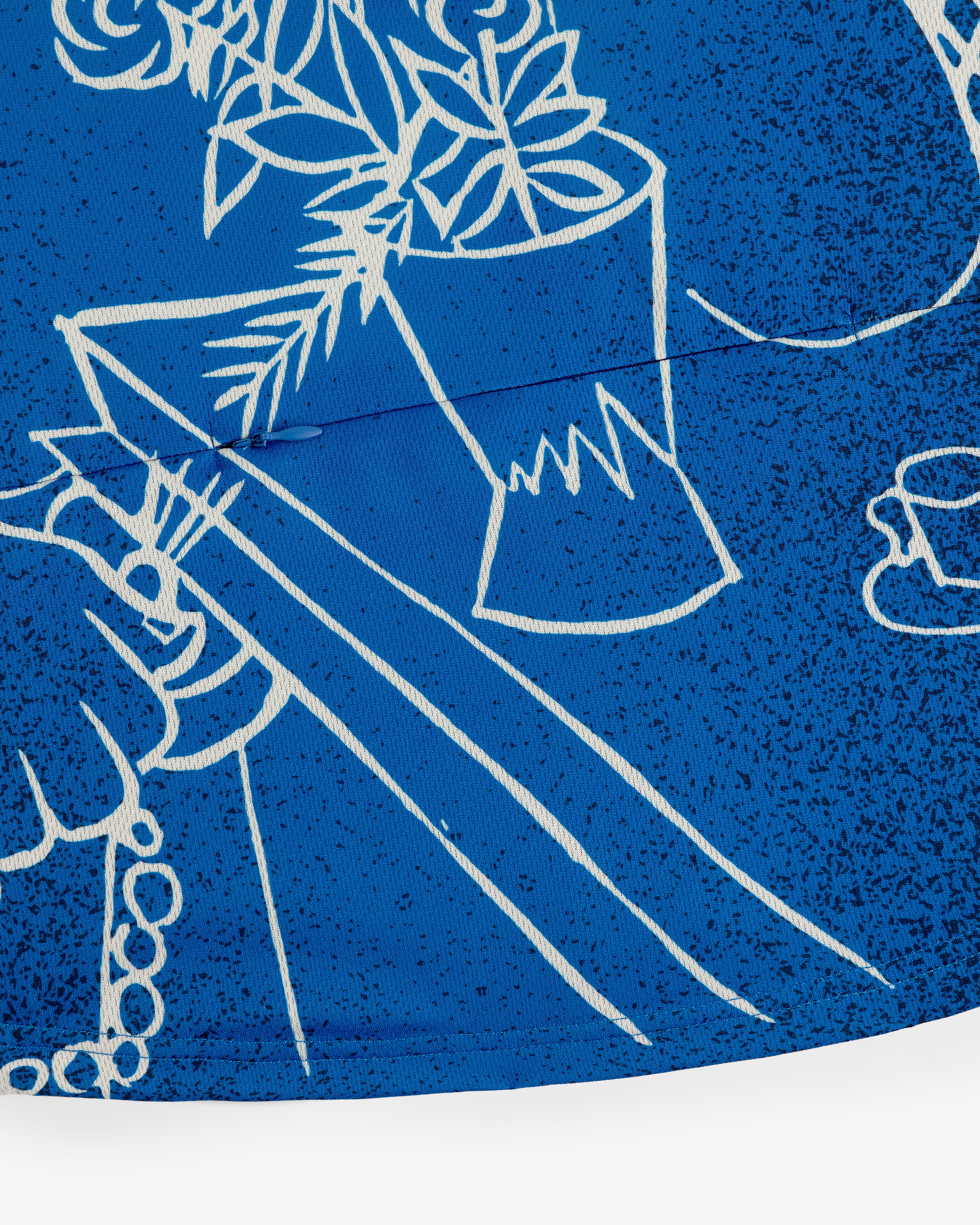 White line art of hands, flowers in a vase, and teacup on blue on the Fassianos Half-Zip Cycling Jersey.
