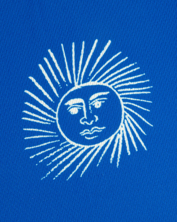 White line drawing of a sun with a face on the Fassianos Half-Zip Cycling Jersey's bright blue background.