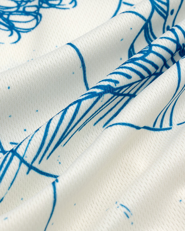 Close-up of white Fassianos Half-Zip Cycling Jersey with blue abstract line art and flowing patterns.