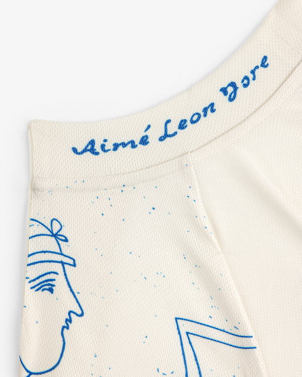 Cream fabric with blue line art face and "Aimé Leon Dore" script on waistband. Fassianos Half-Zip Cycling Jersey.