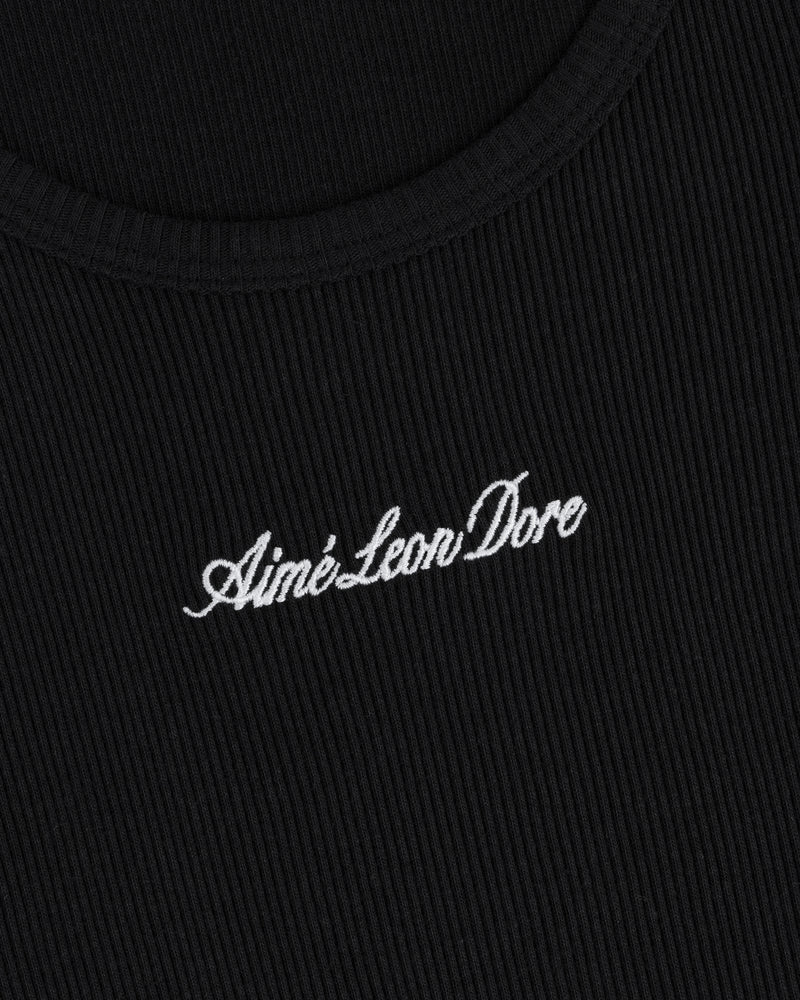 Close-up of black ribbed Embroidered Logo Tank Top with “Aimé Leon Dore” in white cursive embroidery.