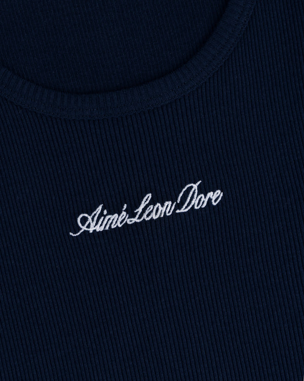 Close-up of navy ribbed fabric on the Embroidered Logo Tank Top with Aimé Leon Dore in white cursive.