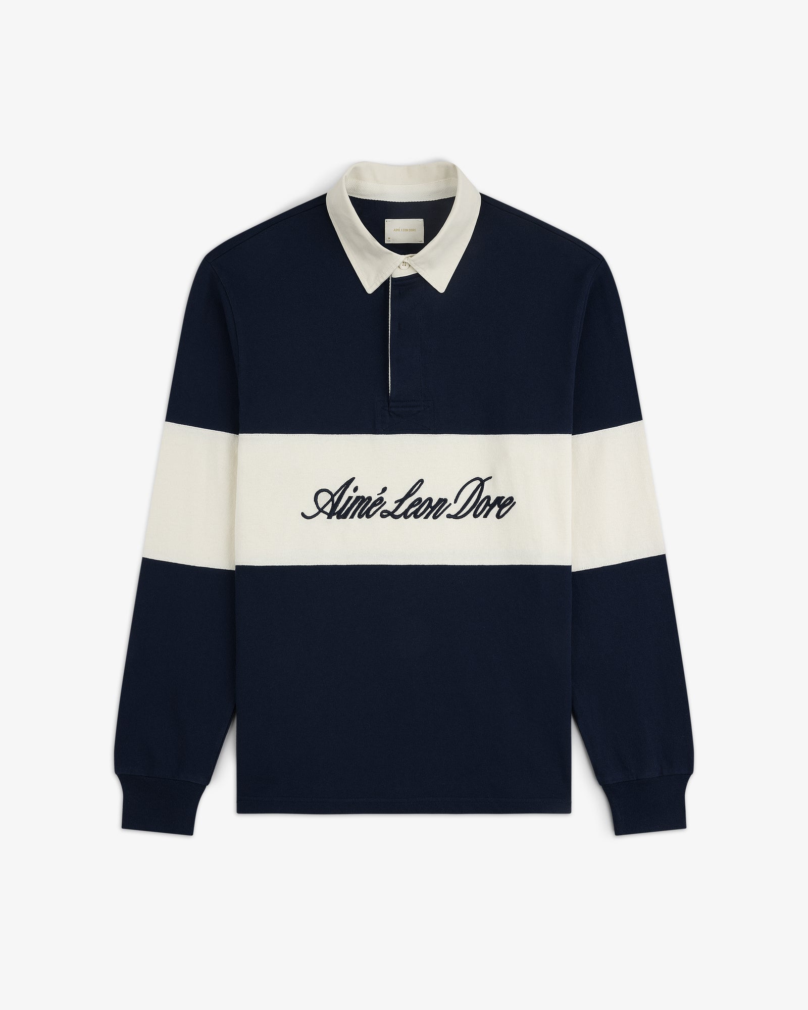 Script Paneled Rugby in navy and white with a white collar and Aimé Leon Dore embroidered across the chest.