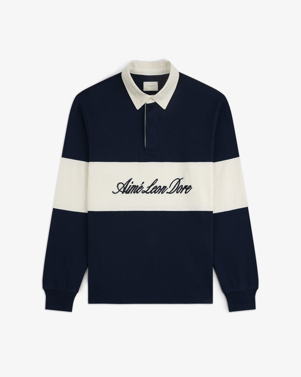 Script Paneled Rugby in navy and white with a white collar and Aimé Leon Dore embroidered across the chest.