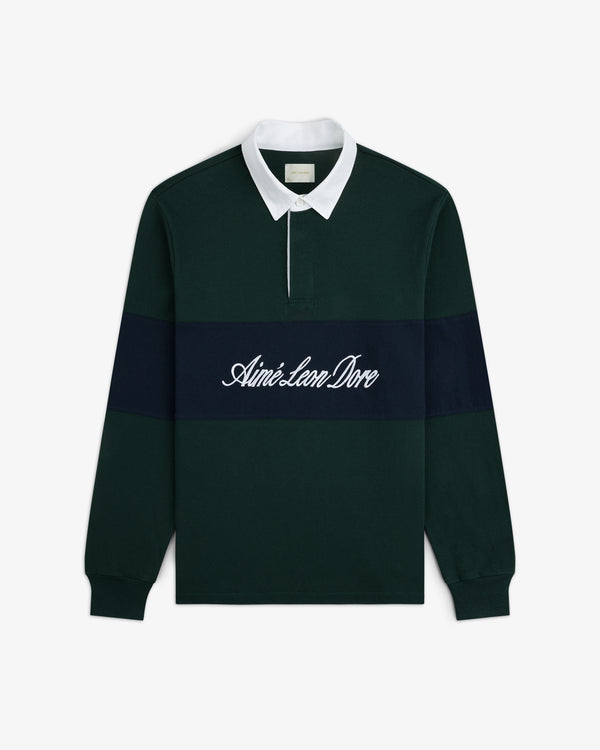 Dark green Script Paneled Rugby with white collar, navy stripe, and Aimé Leon Dore script embroidered on the chest.
