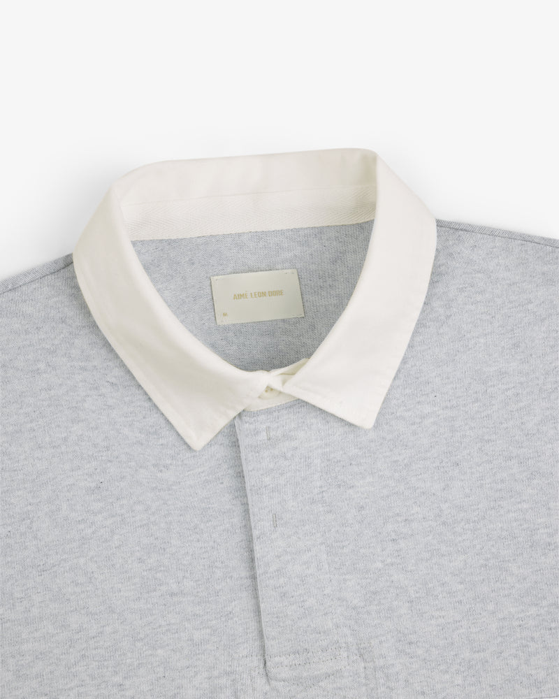 Script Paneled Rugby in light grey with a white collar, shown from the shoulders up on a plain white background.