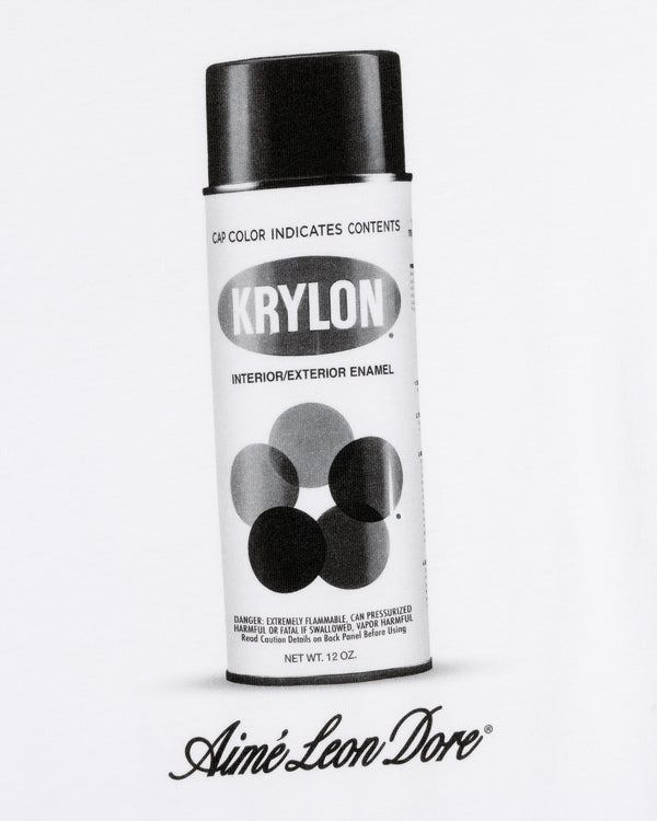 Black and white image of a Krylon Pocket Tee spray paint can above Aimé Leon Dore script on a white background.