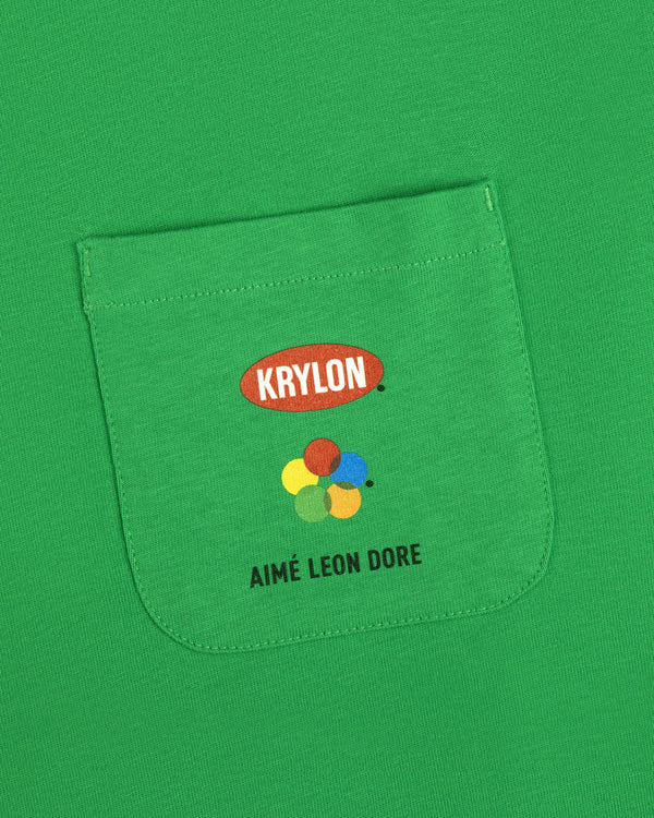 Krylon Pocket Tee: Green shirt with KRYLON logo, colorful paint splatters, and AIMÉ LEON DORE text below.