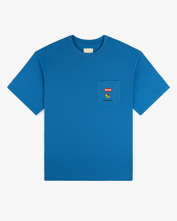 Krylon Pocket Tee: bright blue short-sleeve shirt with chest pocket featuring a small Berlin graphic and text.