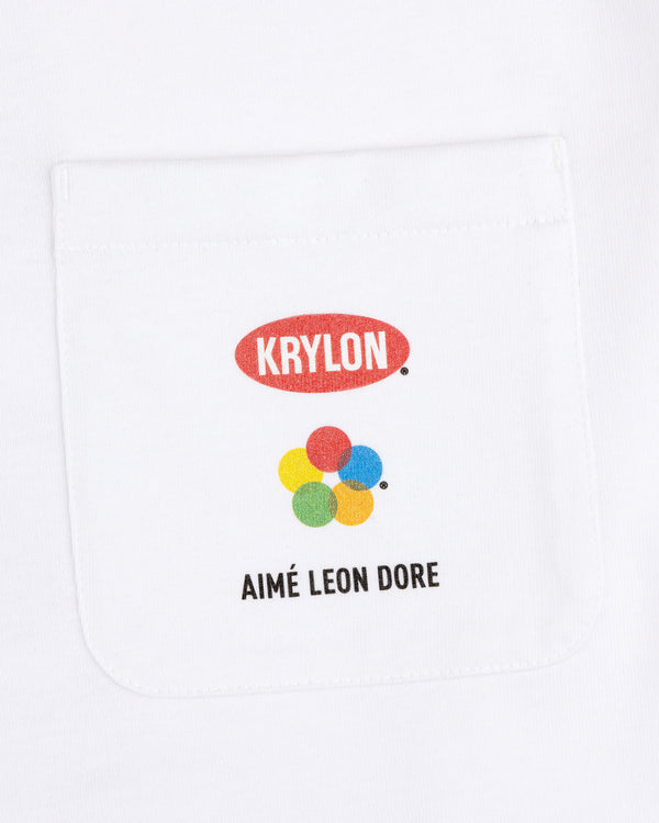 Krylon Pocket Tee: White shirt with KRYLON logo, five colored circles, and AIMÉ LEON DORE text below the pocket.