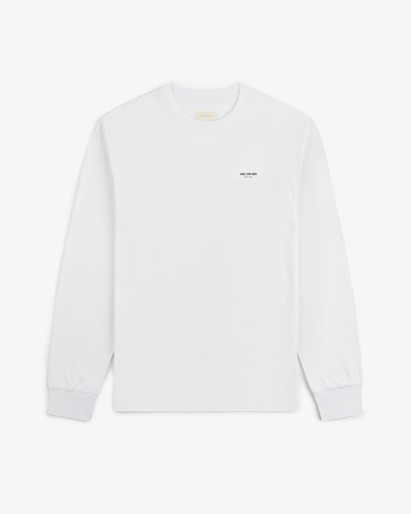 Long-Sleeve Micro Logo Tee in white with small black left-chest text, shown flat on a white background.