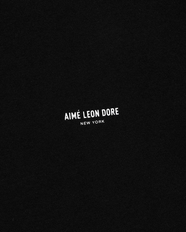 Black Long-Sleeve Micro Logo Tee with small white AIMÉ LEON DORE NEW YORK text centered.