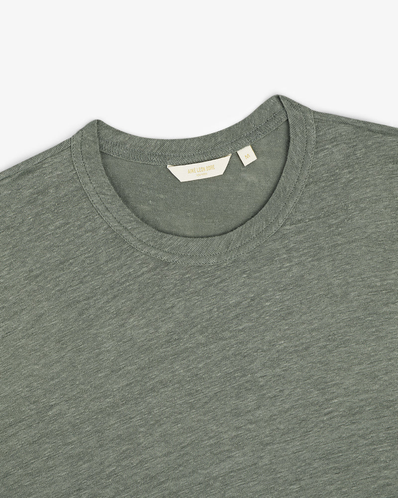 Linen Tee in grayish-green, crew neck style, laid flat to display the collar and inner label.