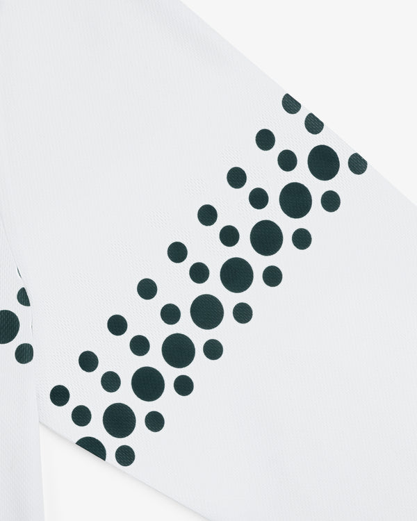 The ALD / Technics Soccer Jersey features white fabric with black dots of various sizes arranged diagonally.