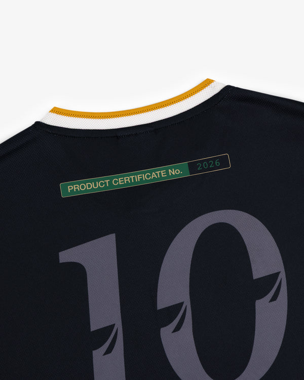 Back of ALD / Technics Soccer Jersey, black, number 10, with green 2026 product certificate label near collar.
