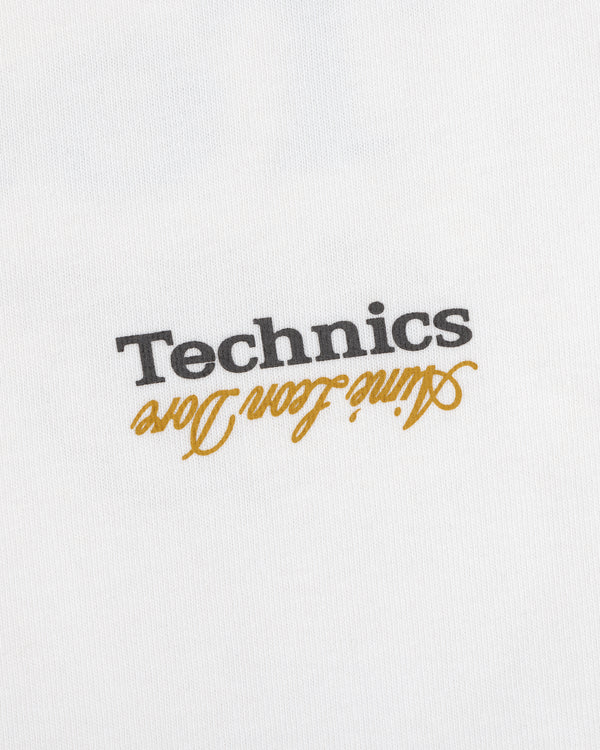 White ALD / Technics Logo Tee with black Technics text and gold Attitude from Long, both upside down.