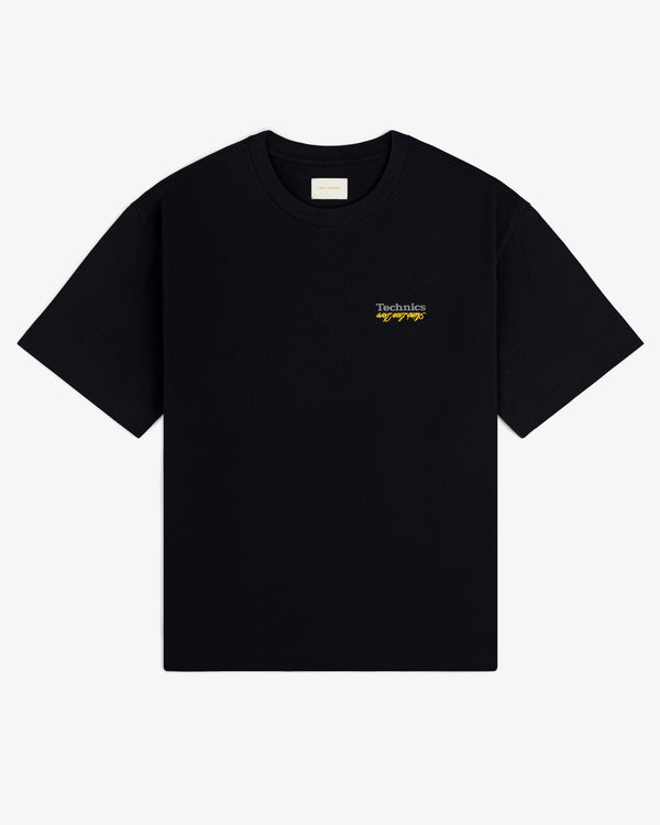 ALD / Technics Logo Tee: Black with small white and yellow "Technics by Design" text on the upper left chest.