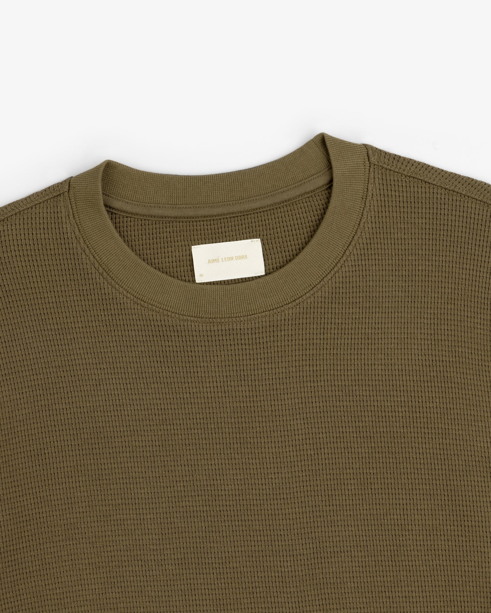 Olive green Long-Sleeve Waffle Thermal with a visible beige neck tag on a white background.
