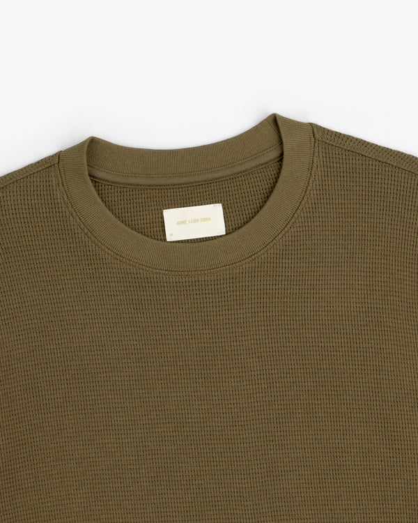 Olive green Long-Sleeve Waffle Thermal with a visible beige neck tag on a white background.