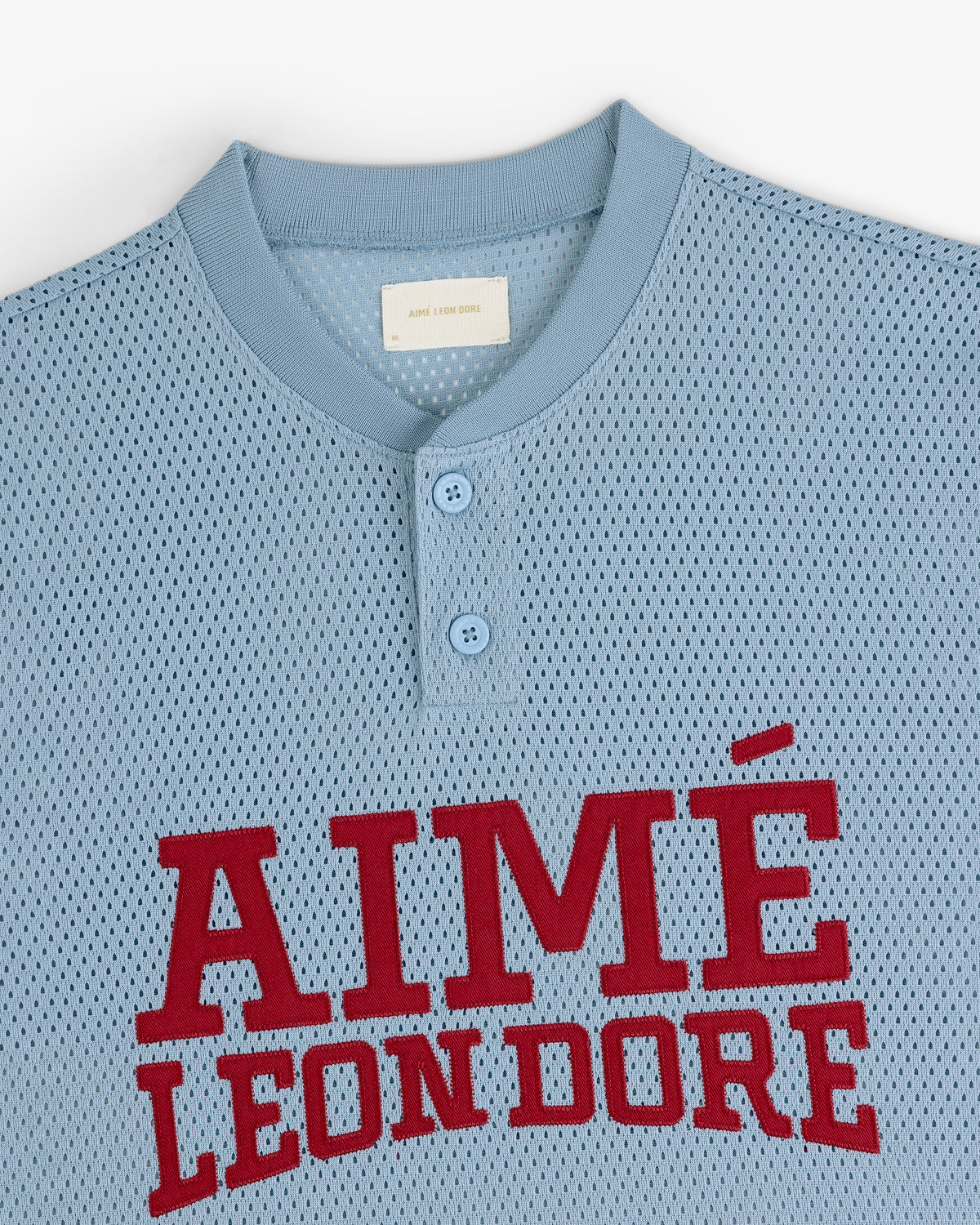 Light blue Mesh Batting Practice Jersey with two buttons and AIMÉ LEON DORE in large red letters on the chest.