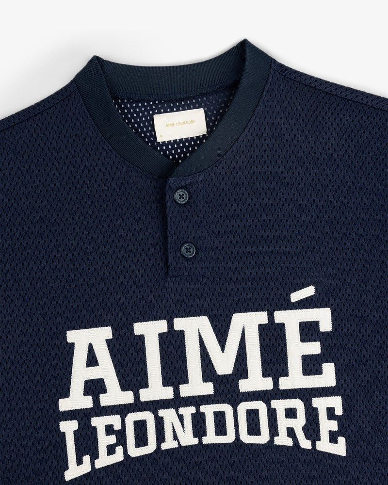 Navy blue Mesh Batting Practice Jersey with AIMÉ LEON DORE in white and two buttons near the collar.