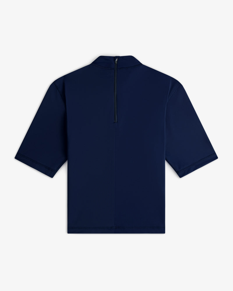 Short Sleeve Crest Rash Guard in navy blue, shown from the back with a black vertical zipper at the neck.