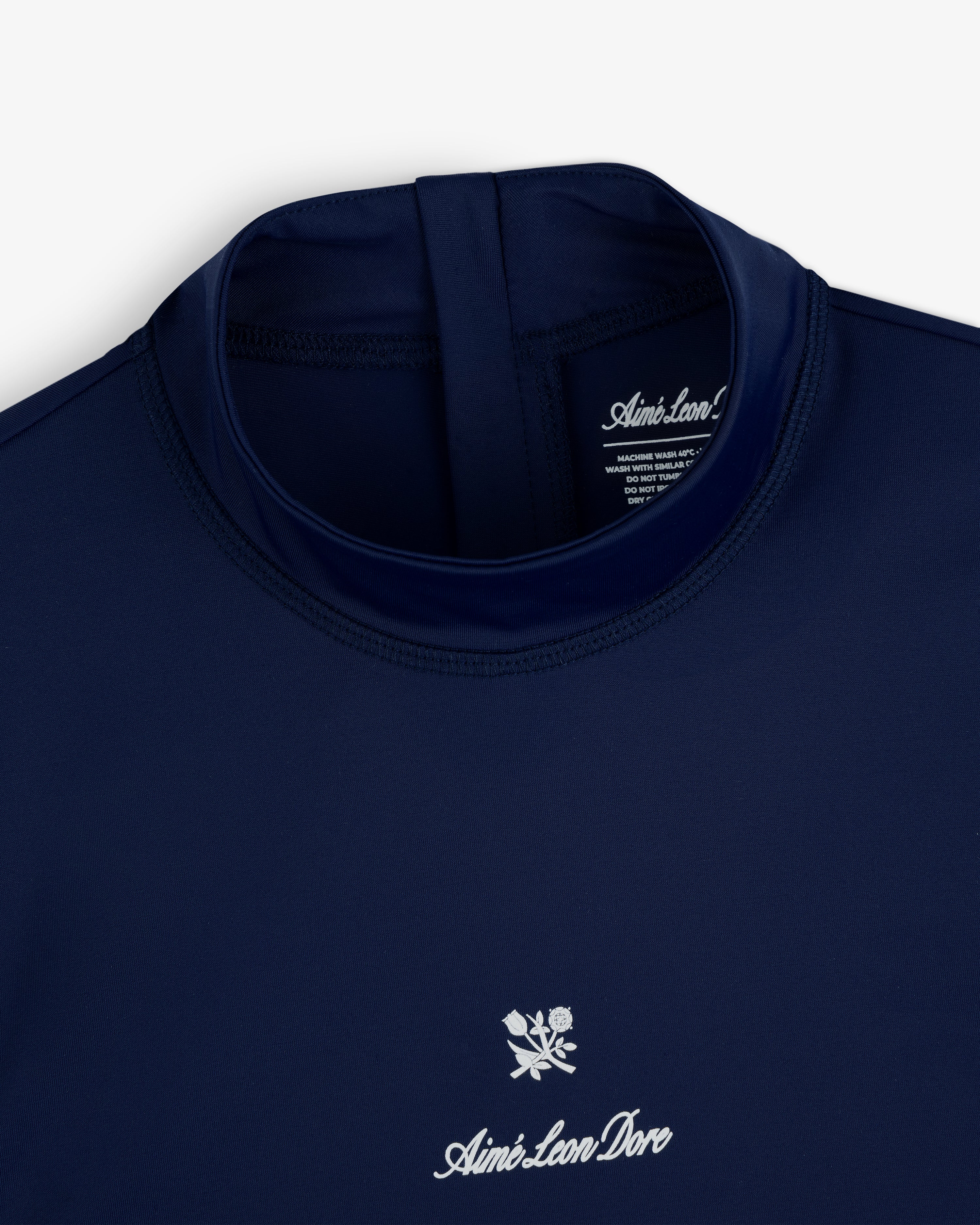 Navy blue Short Sleeve Crest Rash Guard by Aimé Leon Dore with a white logo and rose graphic below the collar.