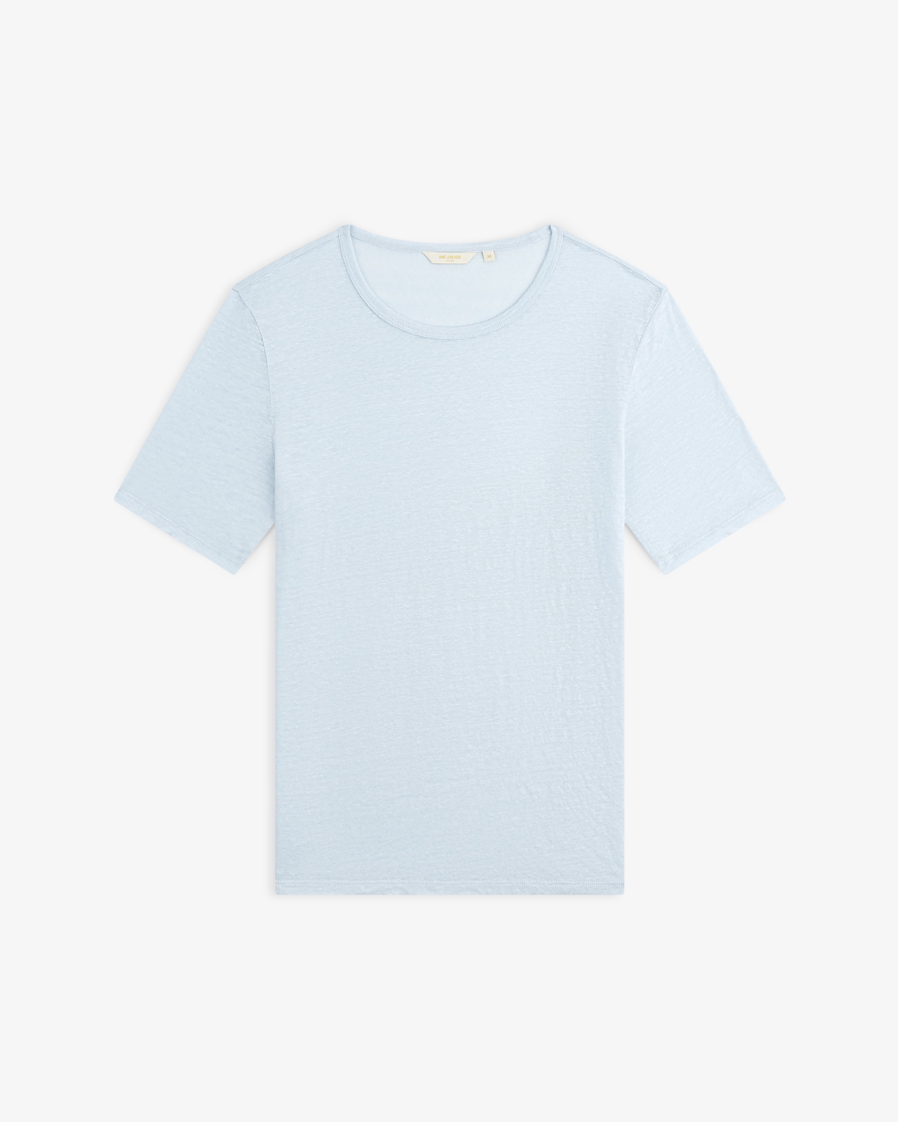 Linen Tee in light blue with short sleeves, laid flat on a white background.