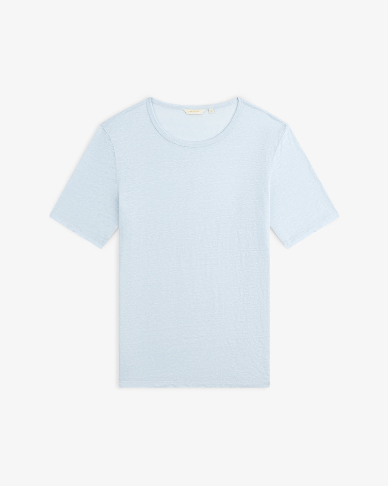 Linen Tee in light blue with short sleeves, laid flat on a white background.
