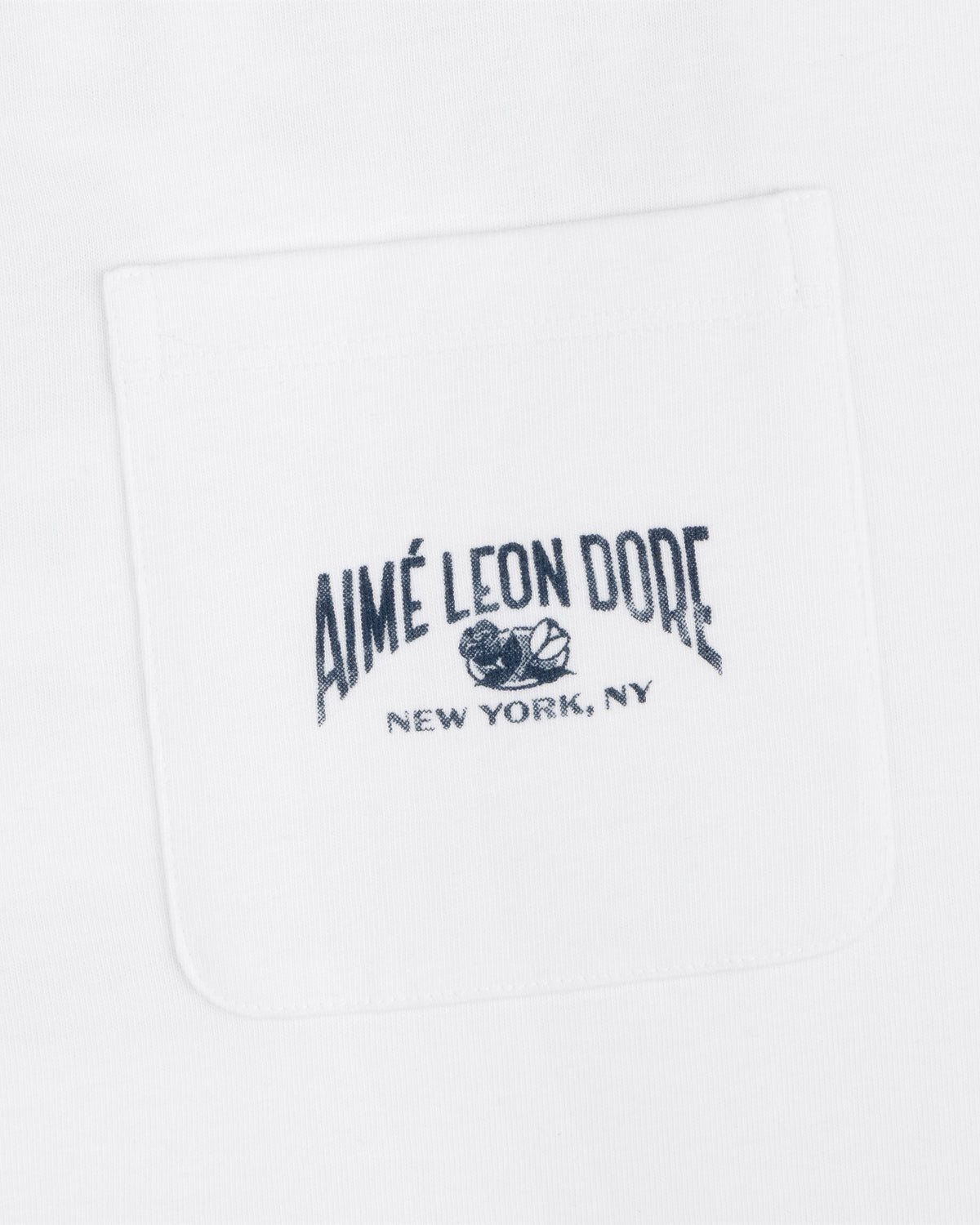 Neighborhood Pocket Tee in white with black "Aimé Leon Dore New York, NY" and rose embroidery on the front pocket.