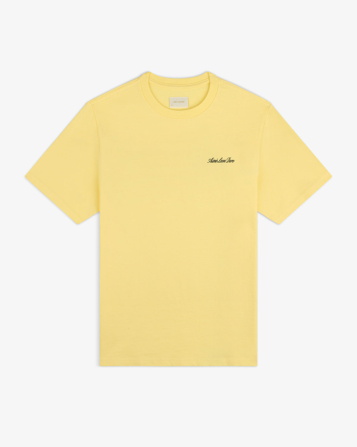 Super Cub Tee: yellow short-sleeve with small black cursive text on left chest, shown on white background.