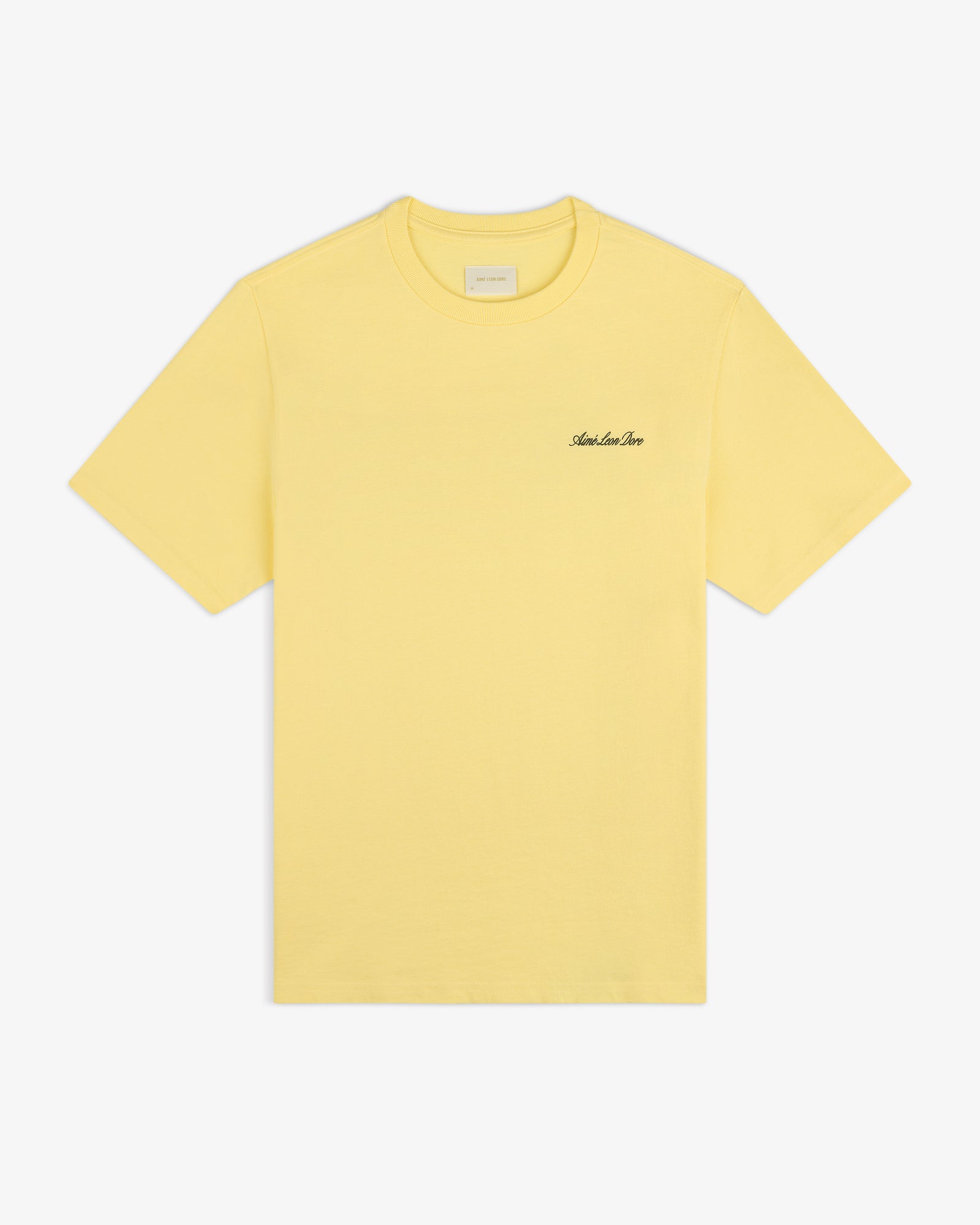 Super Cub Tee: yellow short-sleeve with small black cursive text on left chest, shown on white background.