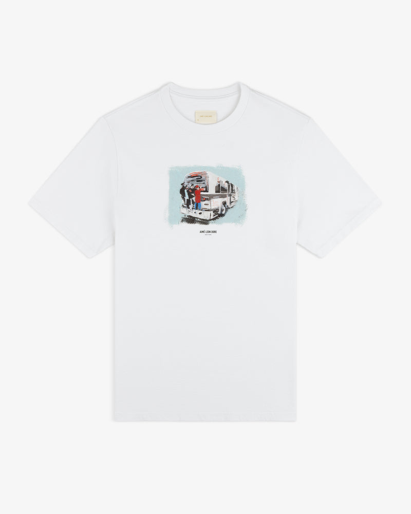 Mesaikos Commuter Tee: white T-shirt with a small illustrated graphic of a truck and people on the chest.