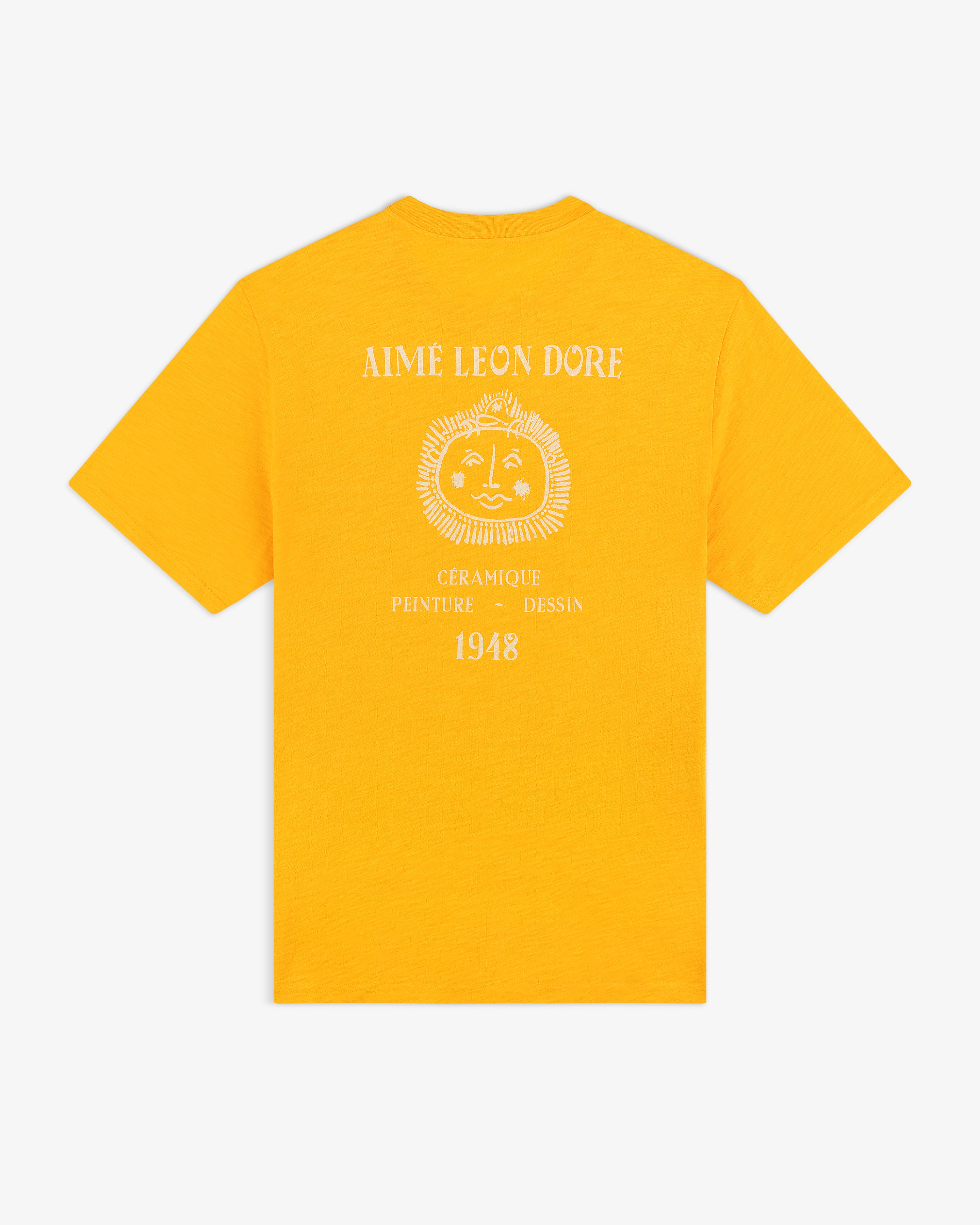 Back of a yellow Artiste Pocket Tee with a sun face graphic and white "Aime Leon Dore" and "1948" text.